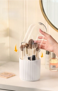 Detailed view of the rotating makeup brush holder with a clear dustproof dome lid cover