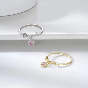 Minimalist S925 sterling silver and gold heart lock pendant rings set on white background