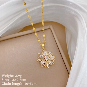 Macro view of golden snowflake pendant with zircons on silk background and specifications