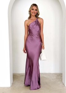 Detail of elegant purple one-shoulder satin maxi dress with a slim-fit fishtail silhouette