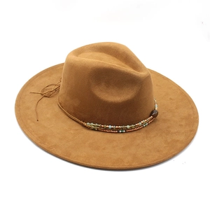 Detail of camel fedora hat featuring multi-colored beaded band and leather cord knots