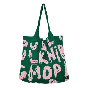 Detailed close-up of forest green and pink knit tote bag showing fine weave texture