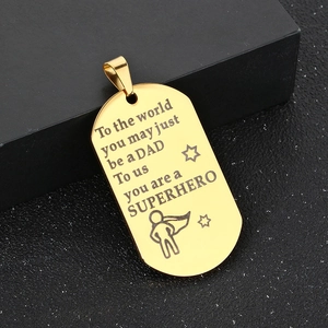 Close-up of golden stainless steel dog tag necklace with Father's Day superhero engraving