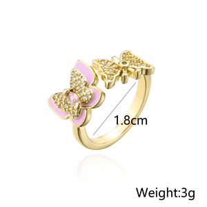 Detail view of 18K gold plated butterfly ring with pink enamel and size 1.8cm marking