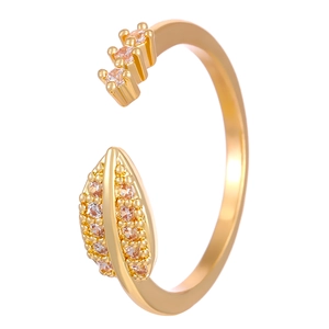 Detailed close-up of gold leaf ring featuring pink and clear cubic zirconia stones