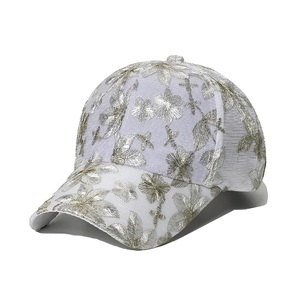 Stylish white baseball cap featuring elegant floral embroidery and breathable lace fabric