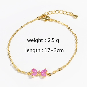 Detailed view of gold butterfly bracelet with pink stones measuring 17+3cm length