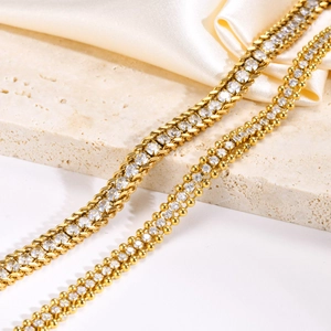 Double layered gold plated stainless steel bracelet with zircon stones on silk fabric
