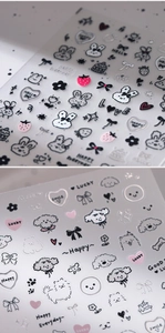 Detailed view of 3D metallic silver nail stickers with cute dog and rabbit patterns