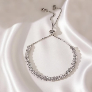 Detail of silver beaded bracelet with textured spiral finish and adjustable bolo clasp