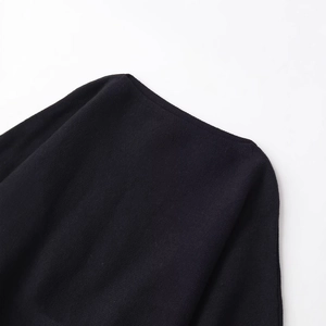 Fashionable black short knitted sweater with elegant puff sleeves and wide round neckline