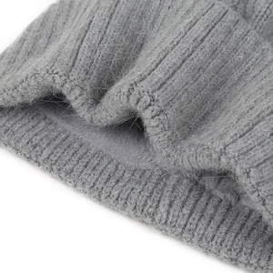 Macro detail of gray rib knit beanie with thick thermal fleece lining for extra warmth