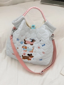 Quilted blue crossbody bag with cute dachshund embroidery and pink adjustable strap