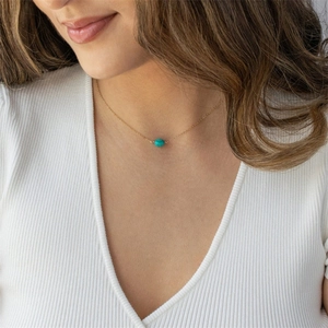 Minimalist gold clavicle chain necklace with a textured oval turquoise bead for women