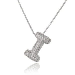 Macro shot of silver letter I pendant with micro-pave cubic zirconia on box chain