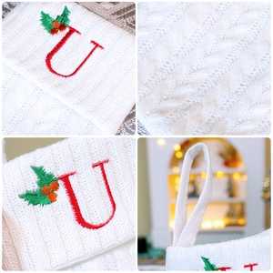 White cable knit Christmas stocking with red letter U embroidery and hanging loop