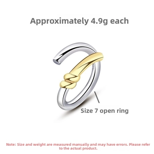 Macro detail of S925 sterling silver twist ring showing gold contrast and hallmark engraving