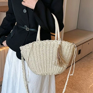 Handmade woven straw tote bag with pearl tassel and round handle for summer style