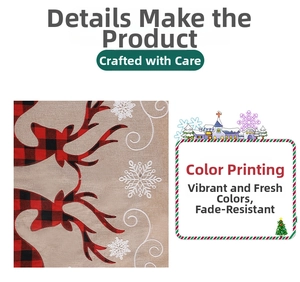 Detail of linen Christmas tree skirt featuring reindeer and snowflake prints in red and white