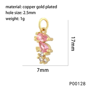Macro detail of a 17mm gold plated seahorse pendant with pink stones and technical specs