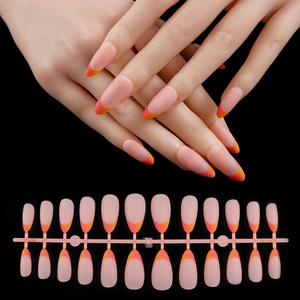 Detail of 24 pieces matte almond press-on nails with pink and orange gradient French tips