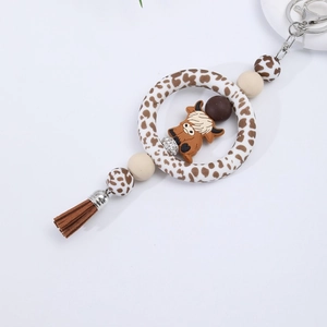 DIY silicone car keychain with leopard print ring, brown bull charm, and stylish tassels