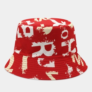 Detail of red graffiti bucket hat with white abstract letters and reinforced stitching