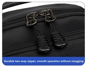 Macro view of sturdy dual metal zippers on black checkered nylon crossbody chest bag