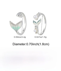 Detail of silver fish tail rings showing 0.70-inch diameter and polished alloy textures