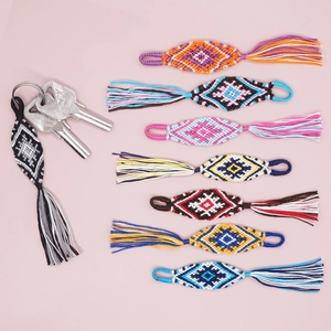 Handmade woven evil eye keychains with rhombic patterns and colorful cotton tassels