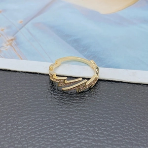 Modern gold plated double lightning ring with pavé zircons in a 45-degree angle view