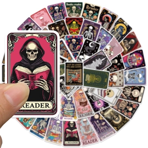 Close-up of skeleton tarot stickers being held to show waterproof vinyl material details