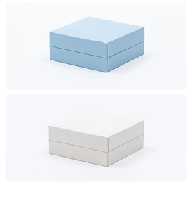 Detail of square light blue and white jewelry gift boxes with smooth PU leather texture