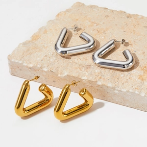 Minimalist geometric triangle hoop earrings in polished gold and silver stainless steel