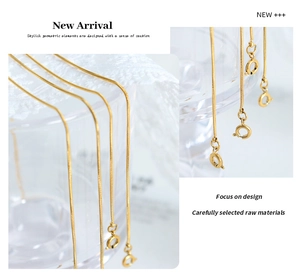 Detailed view of an 18k gold plated flat snake chain anklet with spring clasp