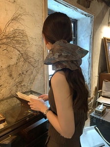 Artistic abstract print fabric scrunchie shown in high ponytail hairstyle on model