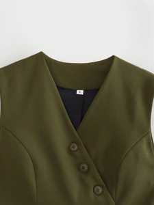 Detail of olive green V-neck vest showing neckline design and buttons on twill fabric