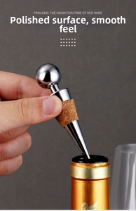 Polished stainless steel wine stopper with a cork seal for prolonging wine oxidation