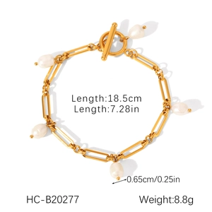 Detail view of 18K gold plated OT buckle bracelet with white teardrop freshwater pearls