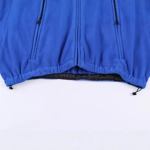 Loose blue fleece ski jacket featuring adjustable drawstring hem and side zipper pockets