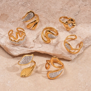 Seven-piece gold stainless steel ring set with geometric waves and zircon leaf accents