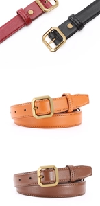 Detail of slim leather belts in red, black, orange, and brown with gold buckles