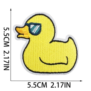 Close-up of yellow duck embroidery patch showing 5.5cm dimensions on white background