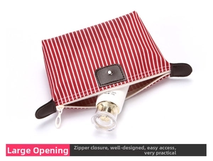 Detail view of red and white striped travel cosmetic bag showing interior storage capacity