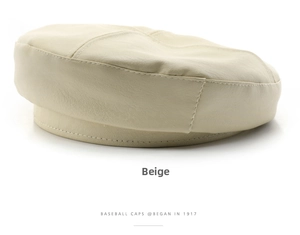 Detailed close-up of beige PU leather octagonal beret with fine stitching and texture