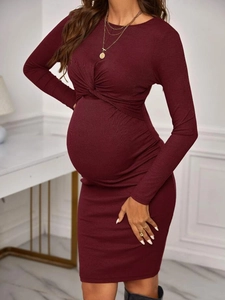 Slim fit dark red long sleeve knit maternity dress with twist knot detail on chest