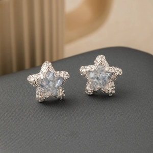 Exquisite silver star stud earrings with light blue faceted crystals for women