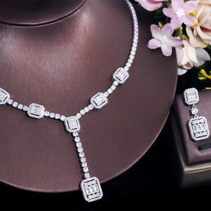 Sparkling zircon bridal necklace and earrings set displayed on a luxury jewelry stand