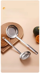 Detailed close-up of 304 stainless steel fine mesh skimmer spoon in a kitchen setting