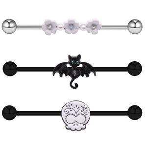 Three industrial barbell piercings featuring white flowers, black cat, and sugar skull